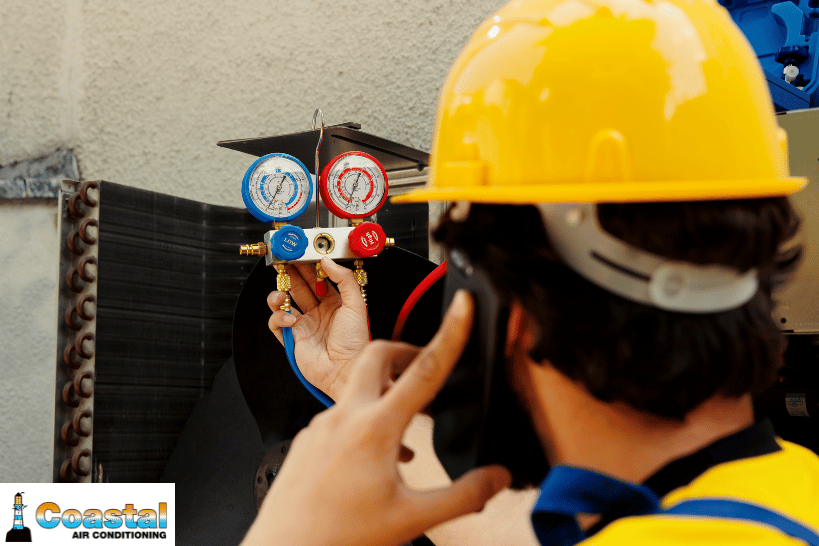 HVAC technician checking residential system efficiency while talking on the phone