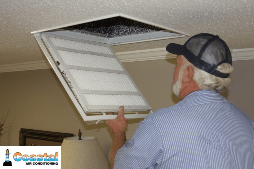 HVAC professional opening unit to change filter